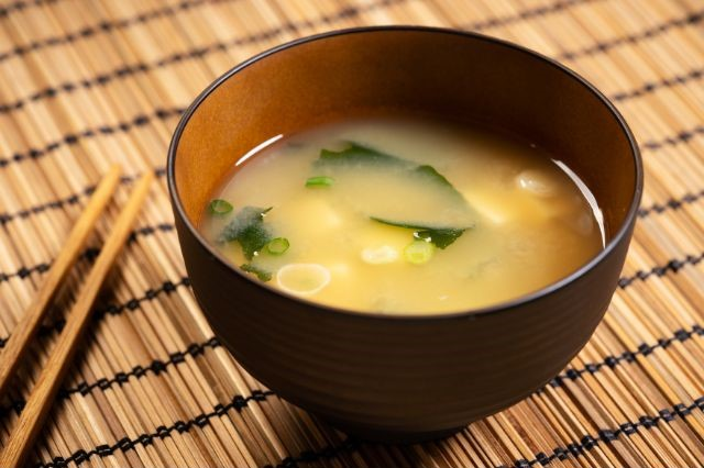 Miso soup with tofu and seaweed in a brown japanese bowl (Is Miso Soup Good For Weight Loss?)
