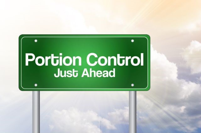 a sign saying portion control just ahead
