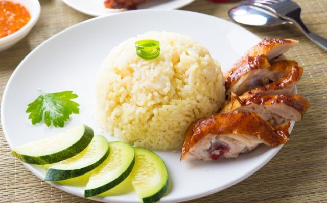 chicken and rice on a white plate
