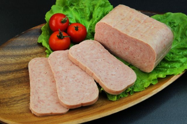 spam meat laying on a wooden plate (Is Spam Good For Weight Loss?)