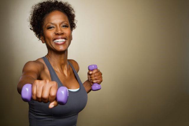 a cheerful woman exercising