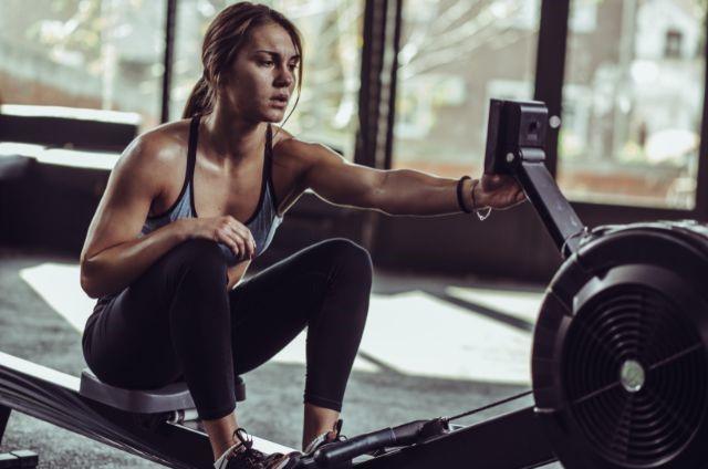 a woman on a rowing machine
