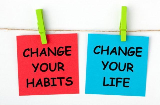 two colorful notes with words change your habit and change your life
