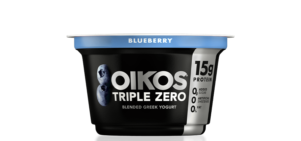 A plain image of a container of Oikos Triple Zero Greek Yogurt with blueberry flavor, showcasing its protein content and no added sugar, artificial sweeteners, or fat.