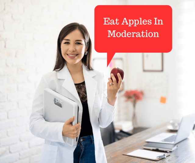 A nutritionist holding an apple with a speech bubble "Eat Apples In Moderation".