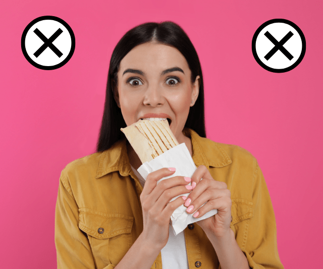 A woman with wide eyes takes a big bite from a wrapped sandwich, with two "X" marks on either side of her, against a pink background.