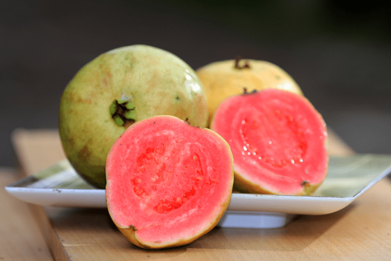 a couple of pieces of guava on a plate